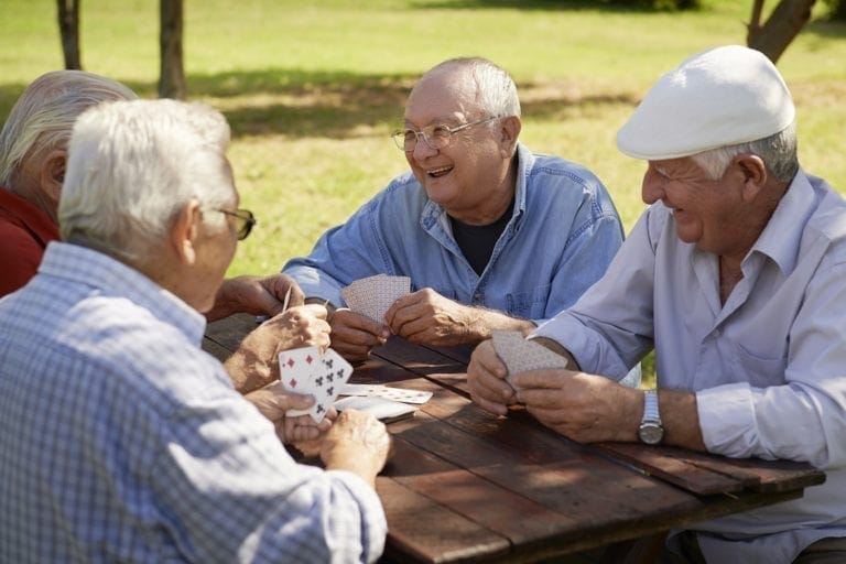 Active seniors playing cards