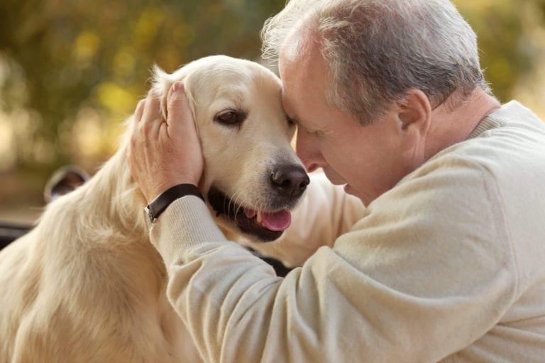 Senior with dementia enjoying pet therapy