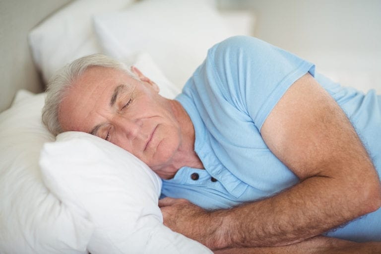 Senior getting a good night’s sleep to delay the onset of Alzheimer’s disease