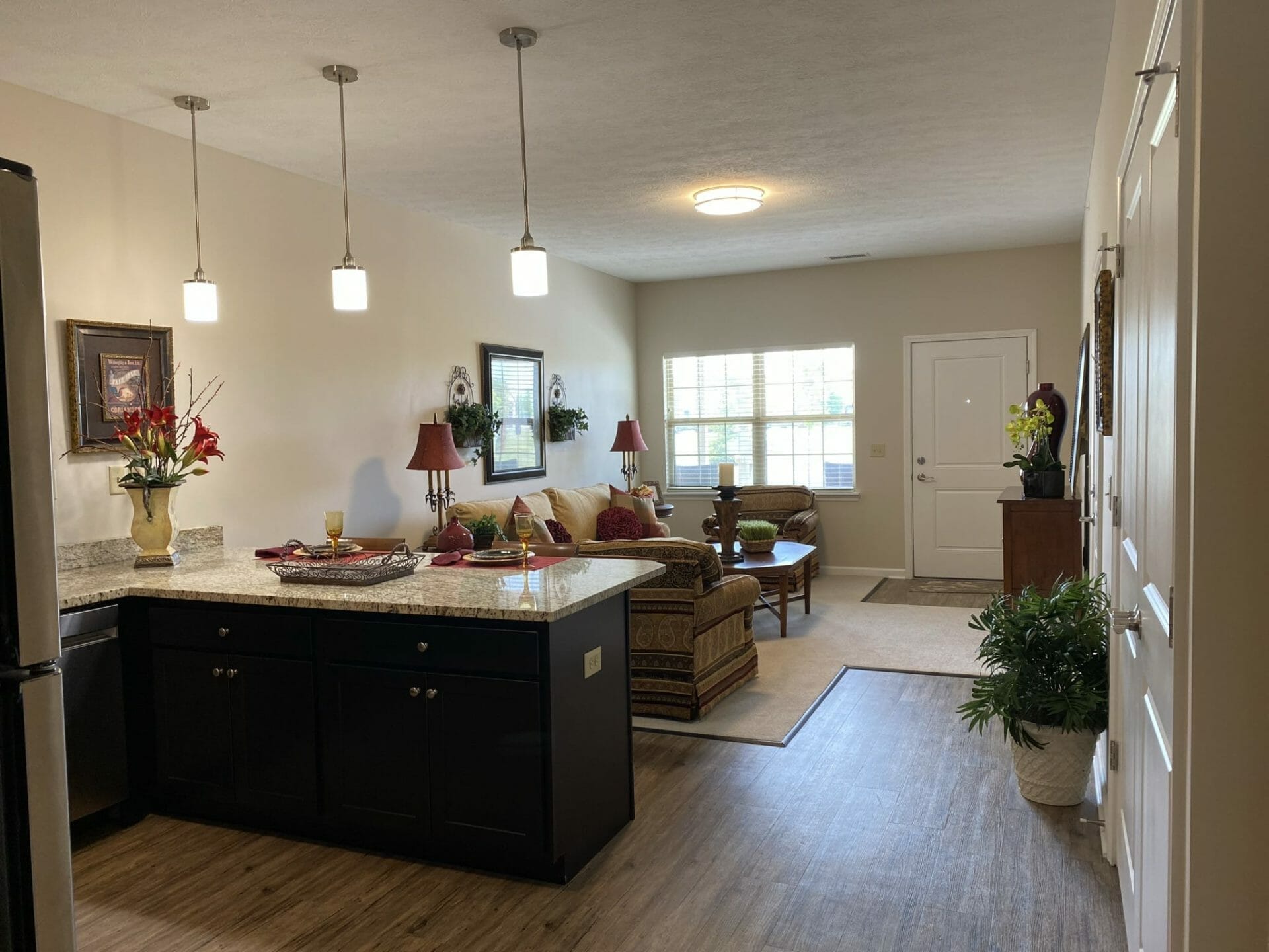 <span  class="uc_style_uc_tiles_grid_image_elementor_uc_items_attribute_title" style="color:#000000;">Aster Place Garden Home Kitchen with a view of the living room</span>