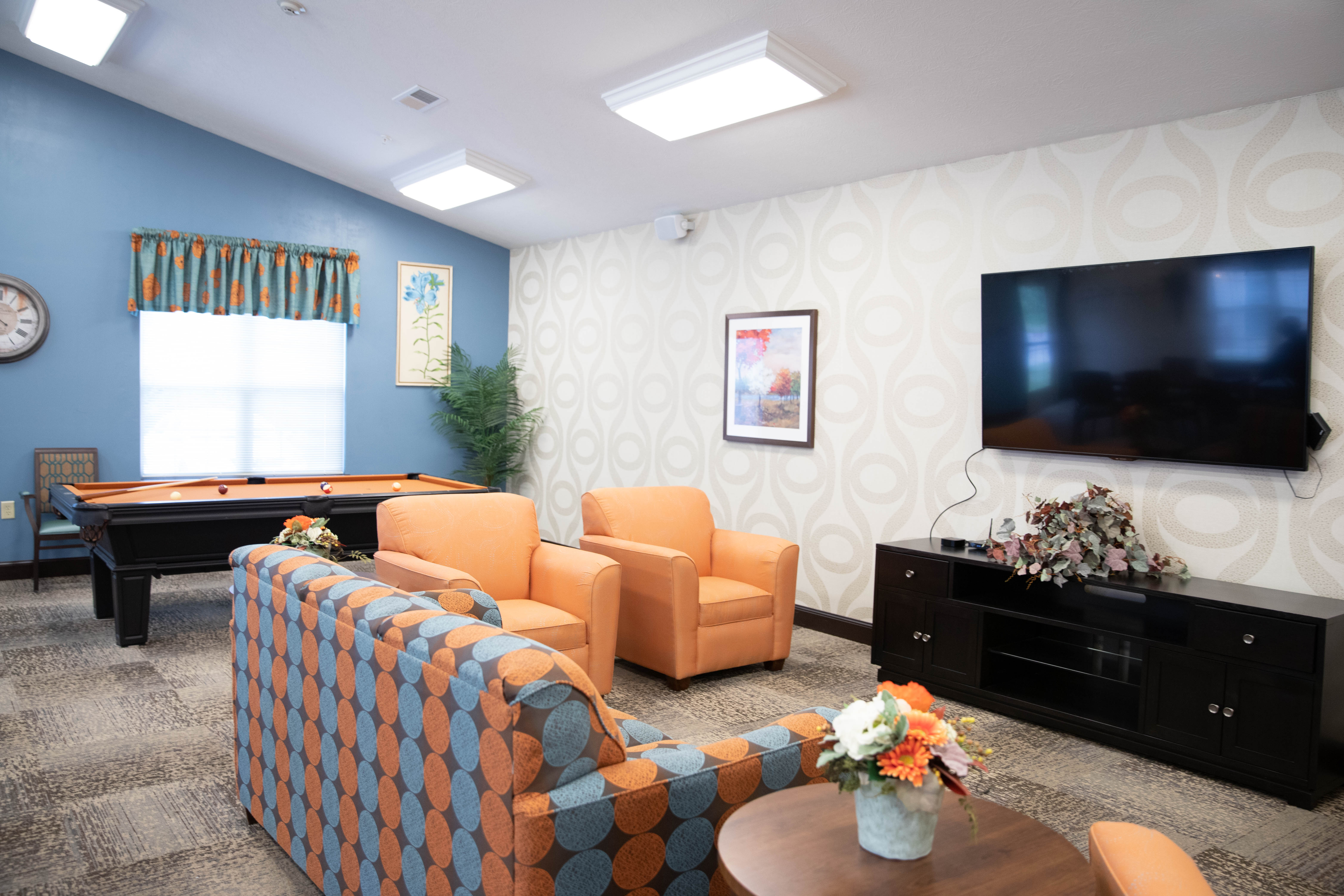 <span  class="uc_style_uc_tiles_grid_image_elementor_uc_items_attribute_title" style="color:#000000;">Aster Place Media Room with seating, tv and pool table</span>
