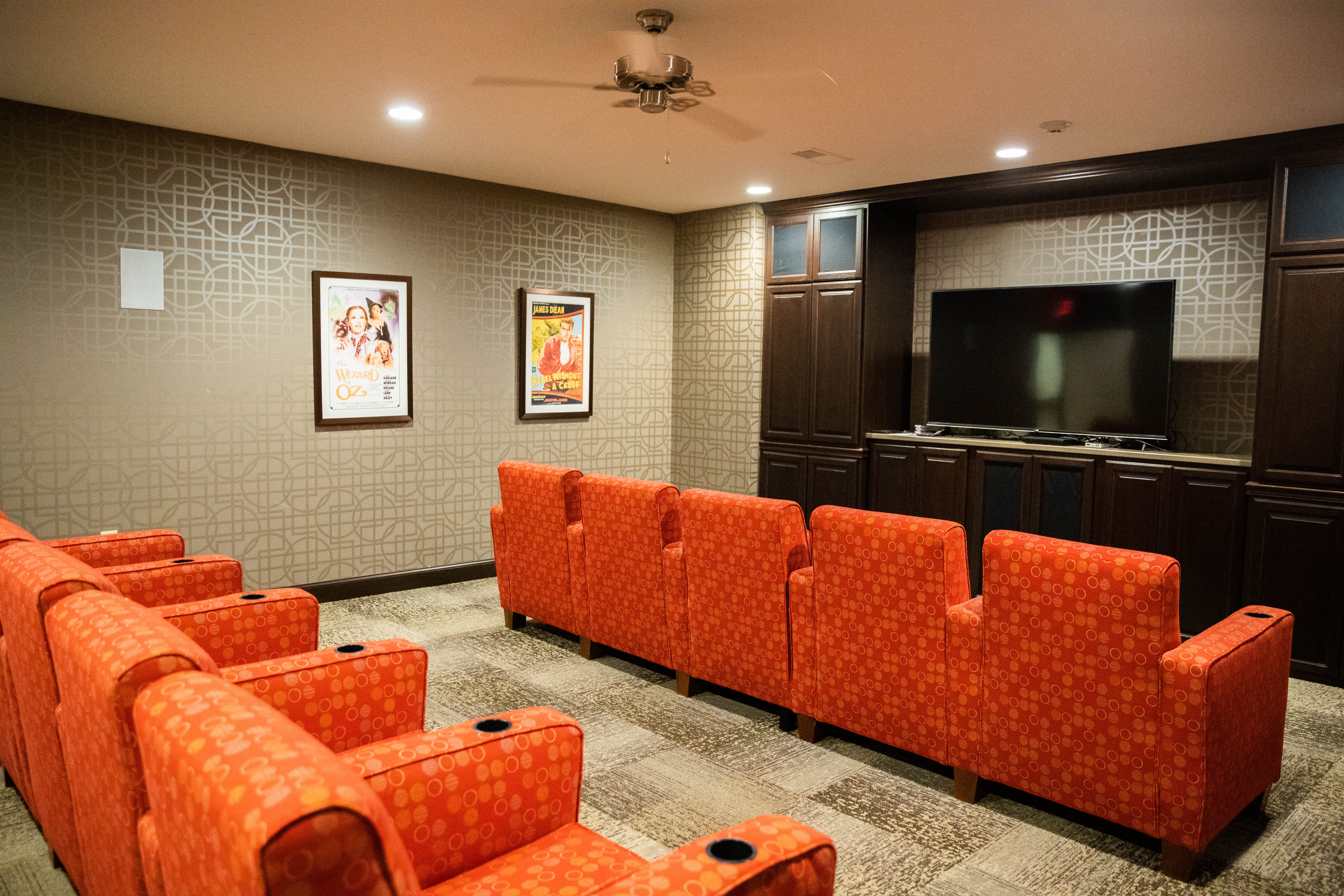 <span  class="uc_style_uc_tiles_grid_image_elementor_uc_items_attribute_title" style="color:#000000;">The resident theater interior at the Aster Place Assisted Living Apartments. </span>