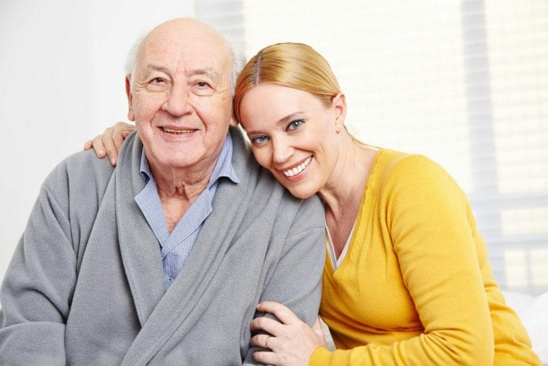 Happy elderly man with daughter