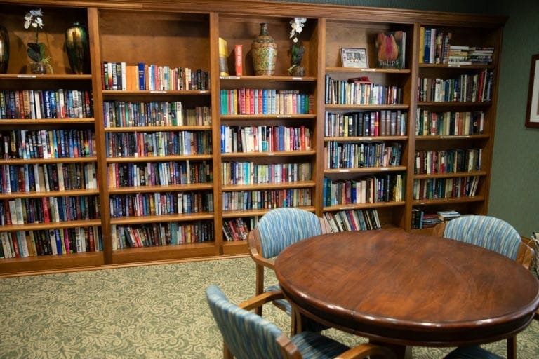 A library wall of five bookshelves.