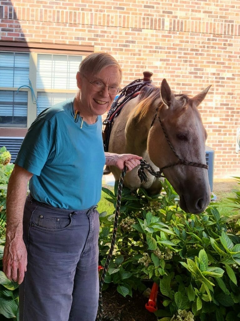 American Village resident with a horse.