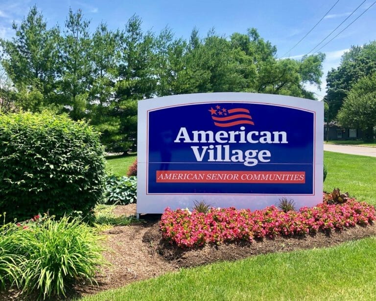 American Village entry sign