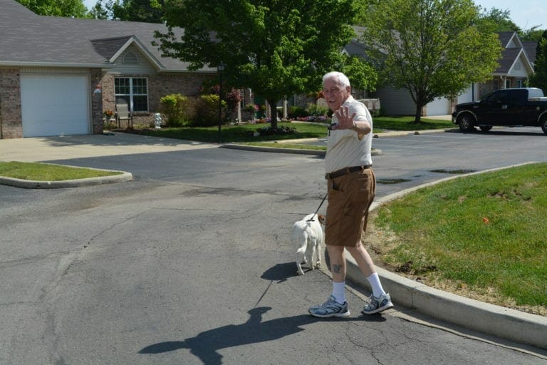 Resident walking along the Spring Mill Meadows community