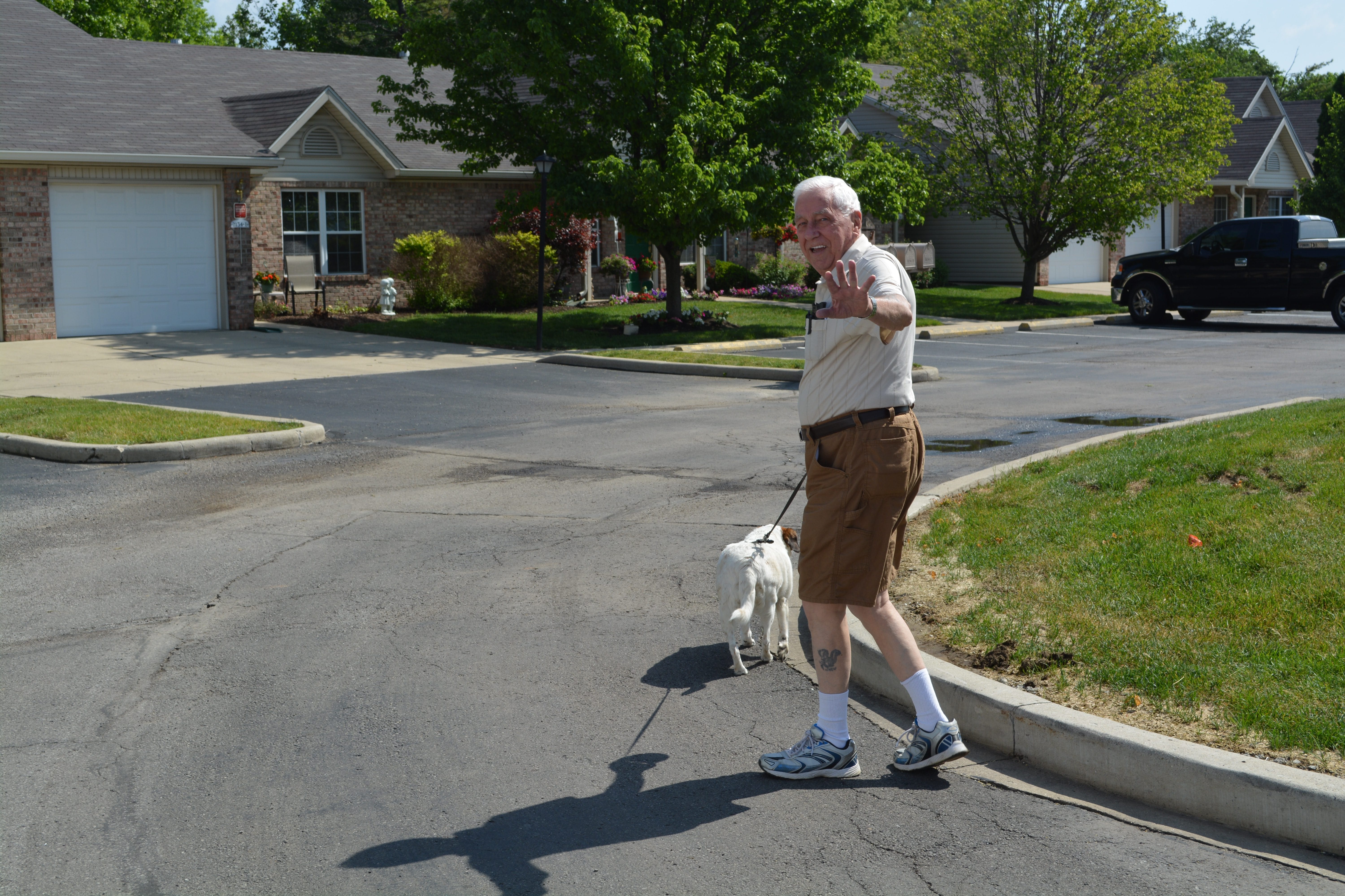 <span  class="uc_style_uc_tiles_grid_image_elementor_uc_items_attribute_title" style="color:#000000;">Resident walking his dog along the Spring Mill Meadows community</span>
