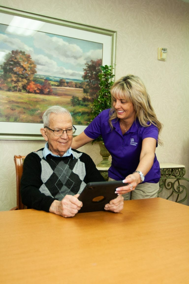 Allisonville Meadows Assisted Living memory care resident and aide.