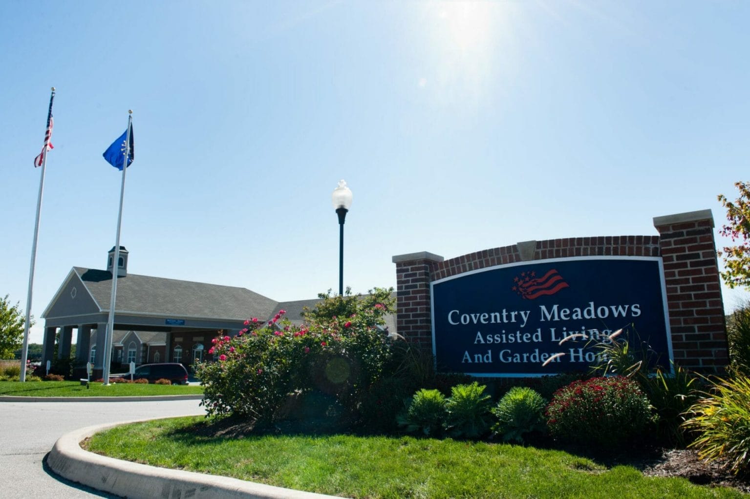 Outside of the main entrance at Coventry Meadows Assisted Living building.