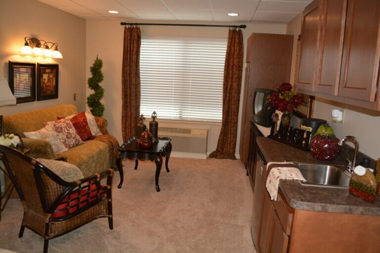 Bethany Village Assisted Living Apartments kitchenette and living room.