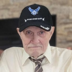 Centenarian Robert Reith with blurred brick background
